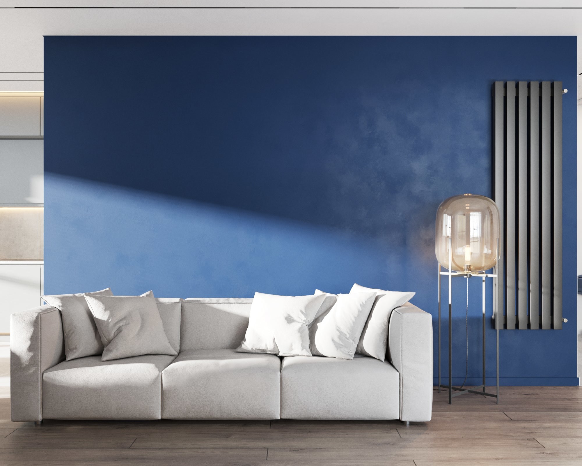 Белый диван на фоне синей стены